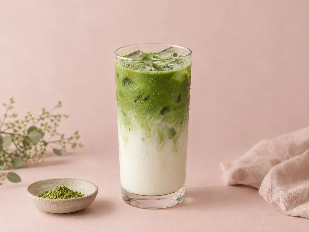 An iced matcha latte in a tall glass