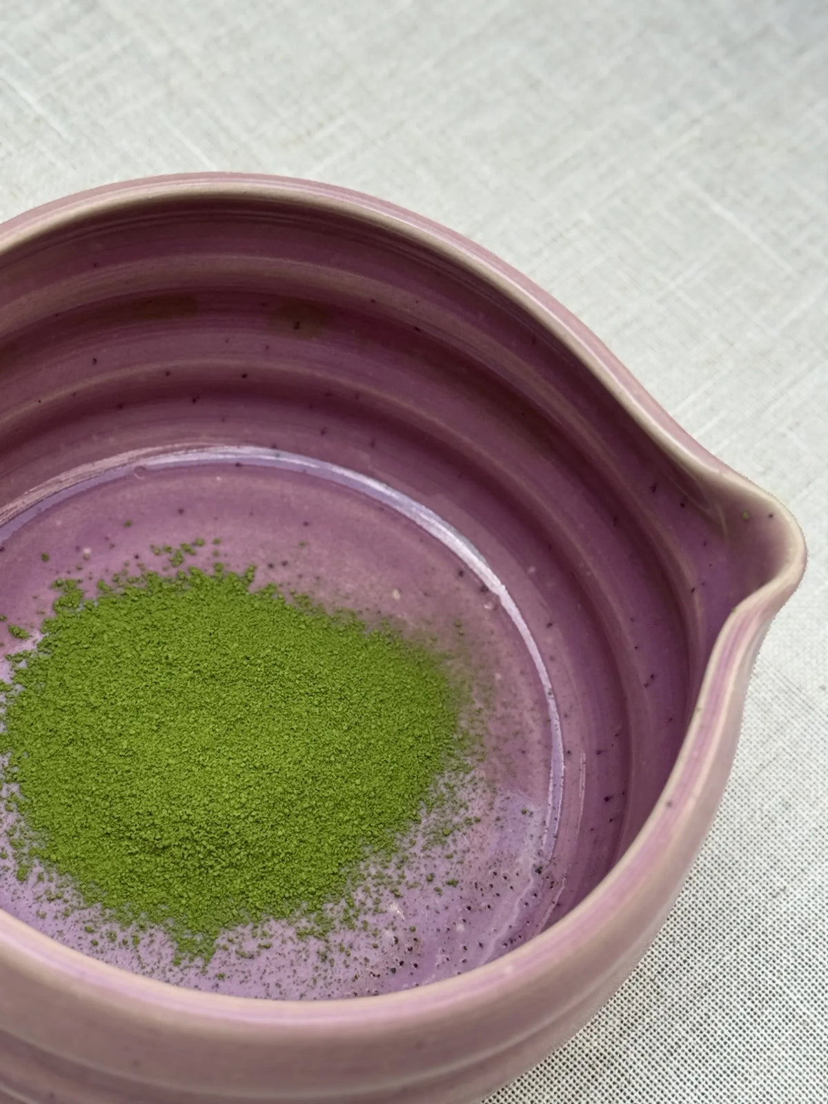 Matcha powder in a pink spouted bowl